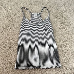 Black and white striped tank with cute frills! Size M